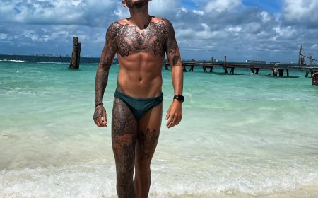 PHOTOS: Champion gymnast Luke Strong and his speedo are heating up beaches around the world