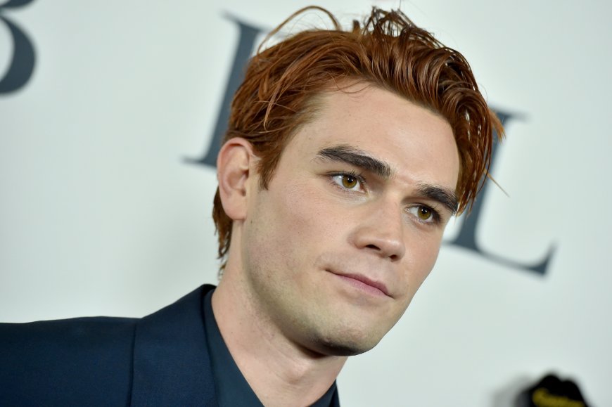 KJ Apa leaves little to the imagination chasing after a dog in his underwear