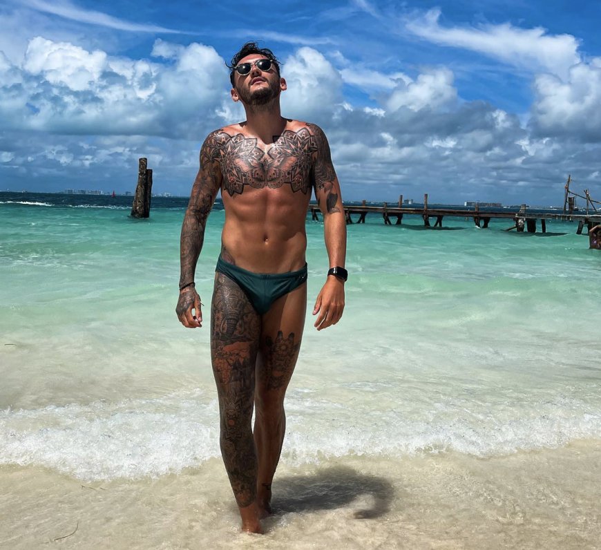 PHOTOS: Champion gymnast Luke Strong and his speedo are heating up beaches around the world