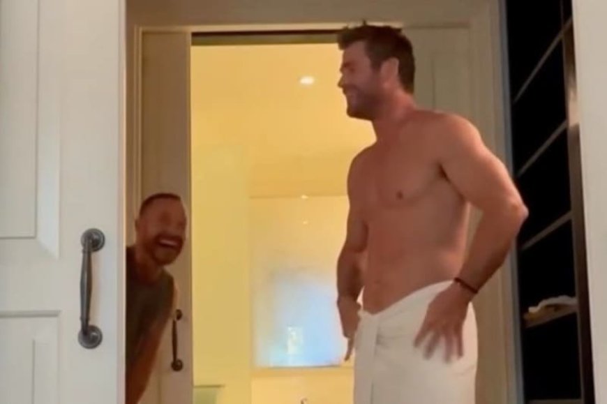 Chris Hemsworth sends fans wild as he shows off muscly torso wearing nothing but a towel