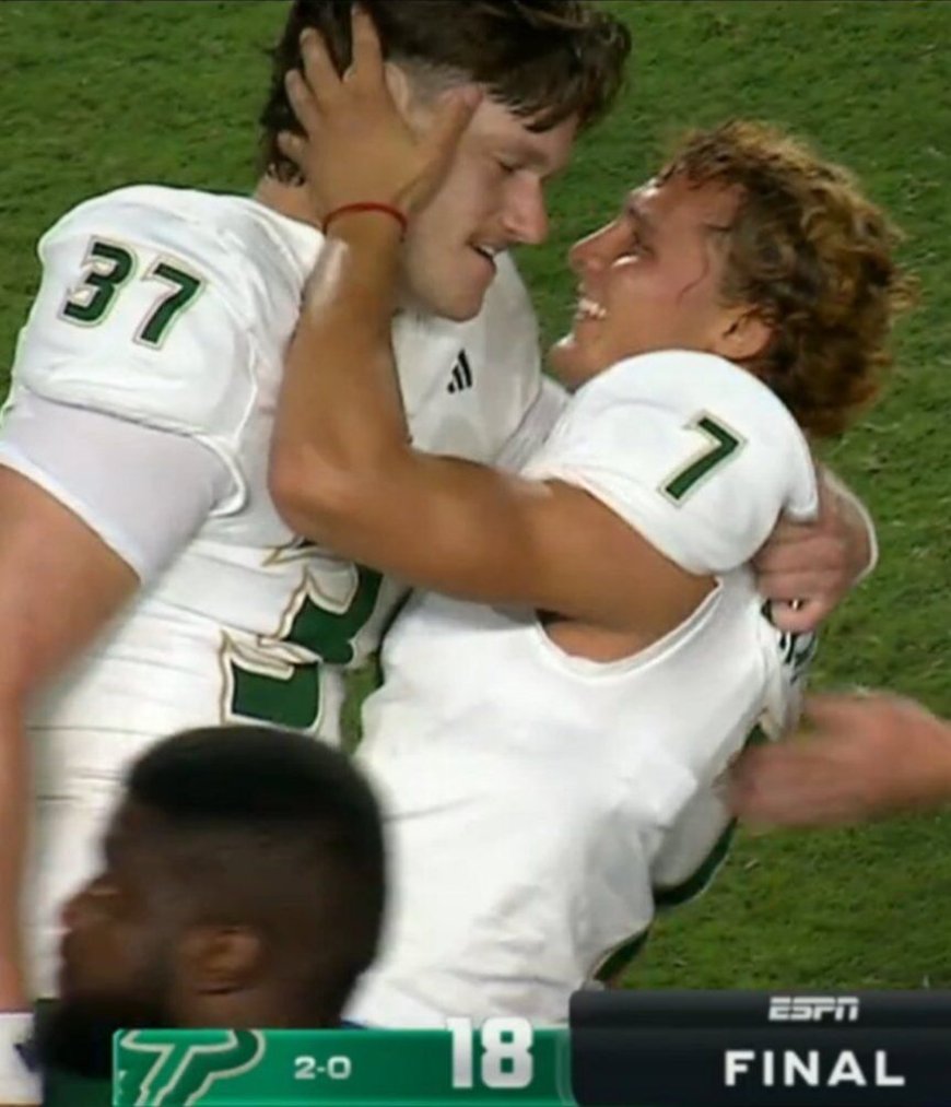 Teammates in love. College football players go viral after their sweet postgame embrace.
