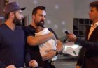 MAGA “Influencer” Confronts Gay Couple Holding Baby, Asks Them About Pedophilia, Reportedly Gets Punched